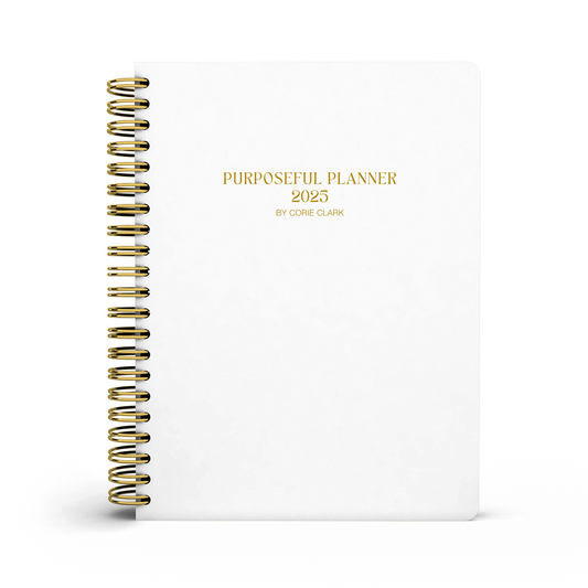 white planner with gold wire binding